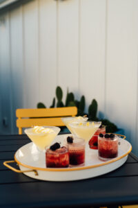 A tray with several different drinks on it.